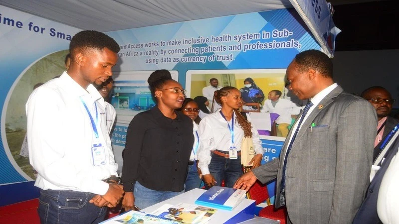 Zamaradi Mbega (2nd-L), Director of Health Innovations with PharmAccess, pictured in Dodoma city earlier this week briefing Health deputy minister Dr Godwin Mollel (R), at the firm’s pavilion at an exhibition.