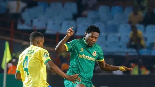 Yanga's midfielder Jonas Mkude (R) challenges Mamelodi Sundowns' midfielder, Teboho Mokoena when the teams took on each other in the second leg of the 2023–24 CAF Champions League last eight which took place in Pretoria last Friday. 