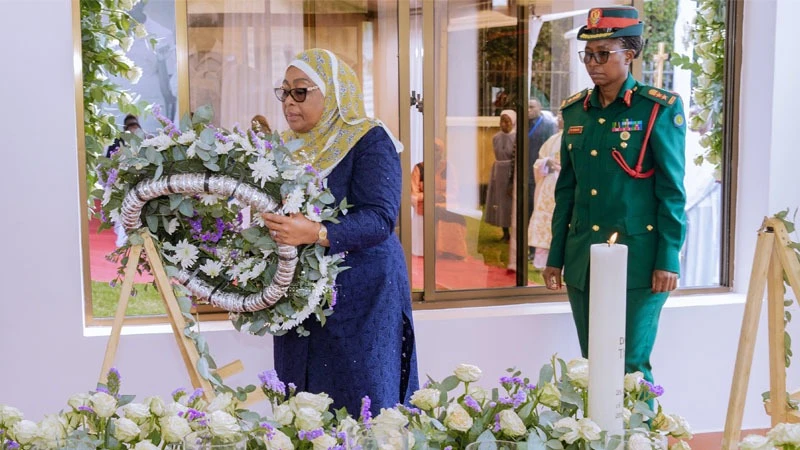 President Samia Suluhu Hassan moves to lay a wreath at the grave of former prime minister Edward Moringe Sokoine at Monduli Juu in Arusha Region yesterday. 