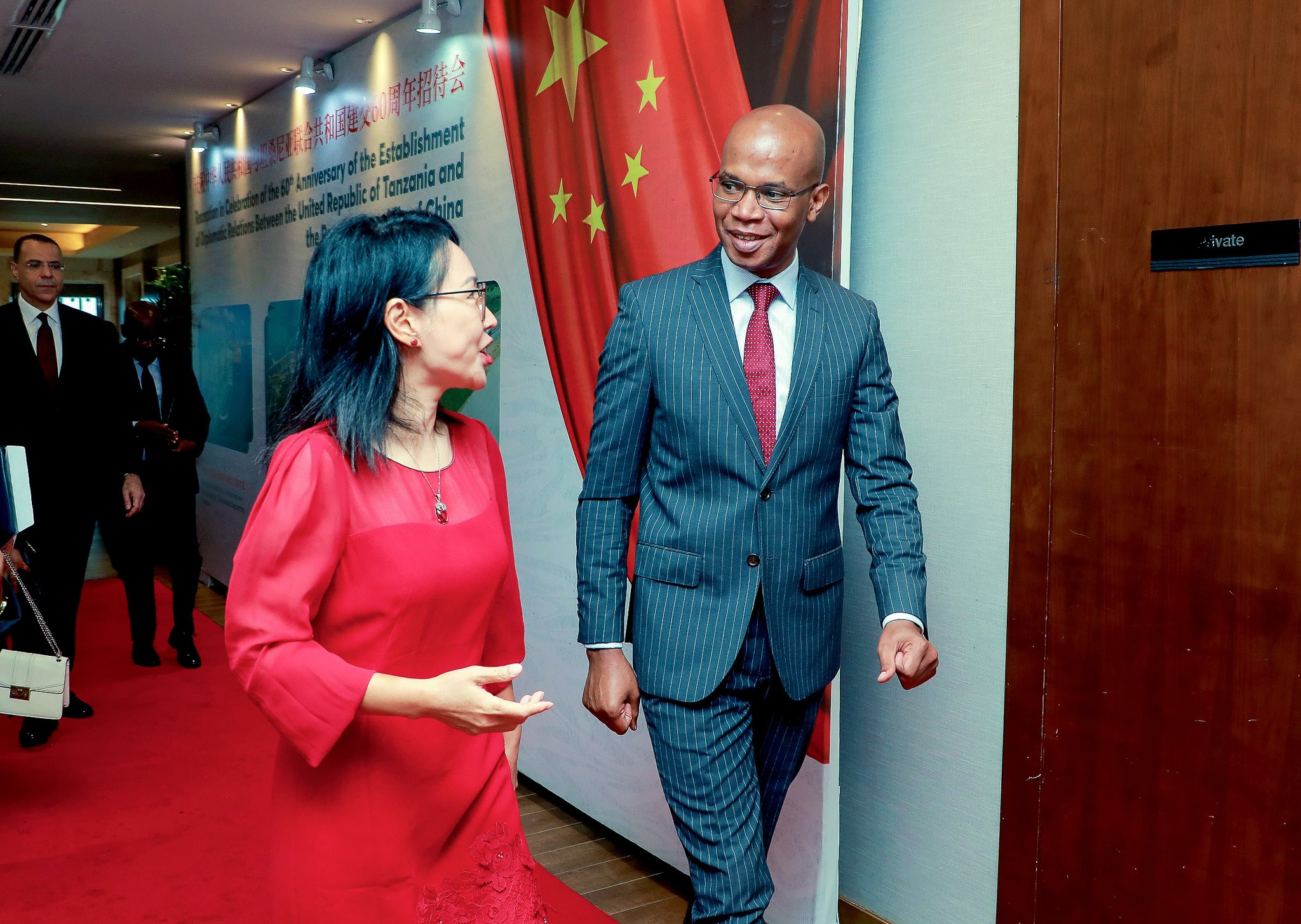 Pic 3  Chinese Ambassador Chen Mingjian (left) and Tanzanian Foreign Minister January Makamba share a quick chat en route to the 60th anniversary celebration of diplomatic ties between Tanzania and China in Dar es Salaam. 