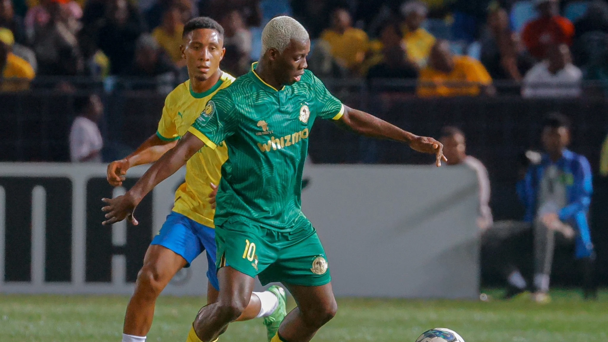 Yanga's midfielder Stephane Aziz Ki (R) seeks to get past Mamelodi Sundowns' midfielder Lucas Ribeiro as the clubs locked horns in the second leg of the 2023–24 CAF Champions League.