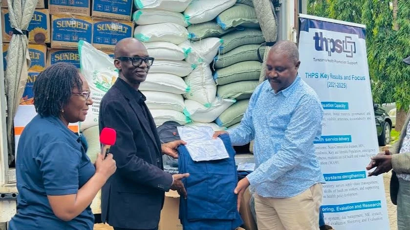 Tanzania Health Promotion Support Board Chairman Prof Mohamed Janabi (C) hands over some assorted items worth 19m/- to the Coast Regional Commissioner Abubakar Kunenge in Kibaha over the weekend as part of their donation to flood victims in Rufiji 