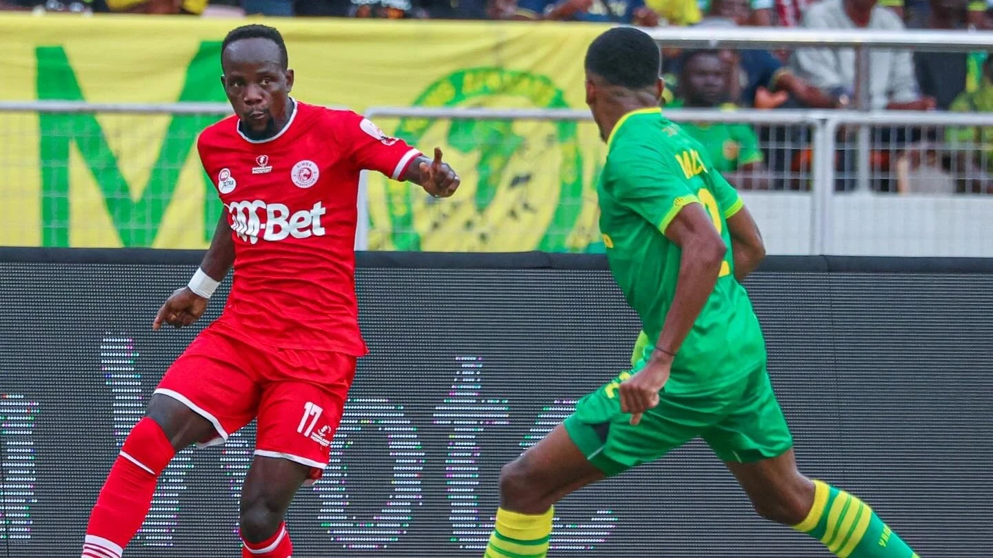 Simba SC's midfielder Clatous Chama (L) seeks to get the better of Yanga's defender,  Ibrahim Abdallah, when the sides took on each other in a 2023/24 NBC Premier League clash in Dar es Salaam last Saturday, culminating in 2-1 win for Yanga.