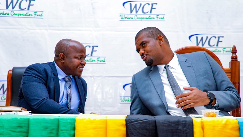 Deogratius Ndejembi (R), Minister of State Prime Minister’s Office (Labour, Employment, Youth and Persons with Disability), has a quick word with Workers Compensation Fund director general Dr John Mduma in Kigoma/Ujiji municipality at the weekend. 