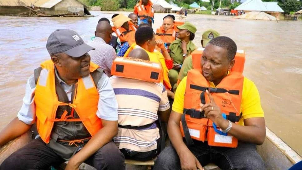 Education, Science and Technology minister Prof Adolf Mkenda (R) exchanges ideas with Coast regional commissioner Abubakar Kunenge while aboard a boat they used on Monday during a visit to Mohoro Primary School in Rufiji District to assess the devastation