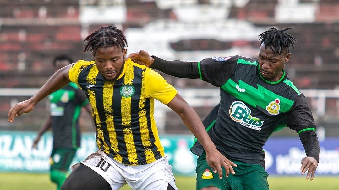Tanzania Prisons' midfielder, Ally Msengi (R), keeps Kagera Sugar's goal-getter Moubarack Amza in check when the teams met in this season's NBC Premier League clash in Mbeya on Monday.  
