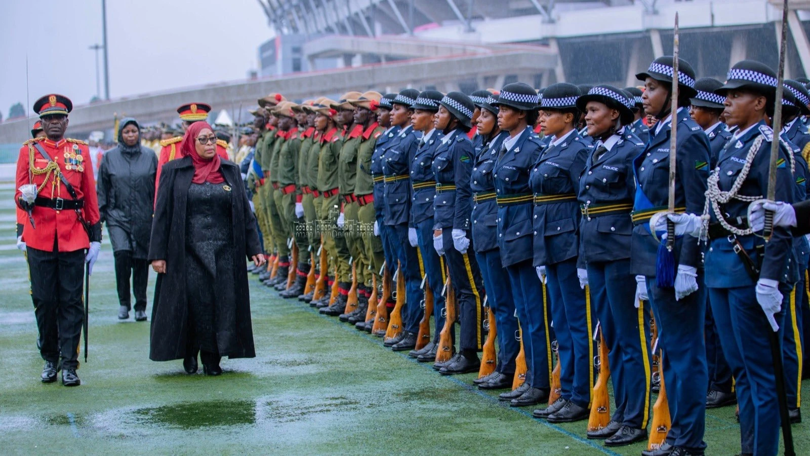 President Samia Suluhu Hassan inspects the guard of honor during the 60-year historic union between Tanganyika and Zanzibar held today at Uhuru Stadium in Dar es Salaam. Photo State House courtesy.