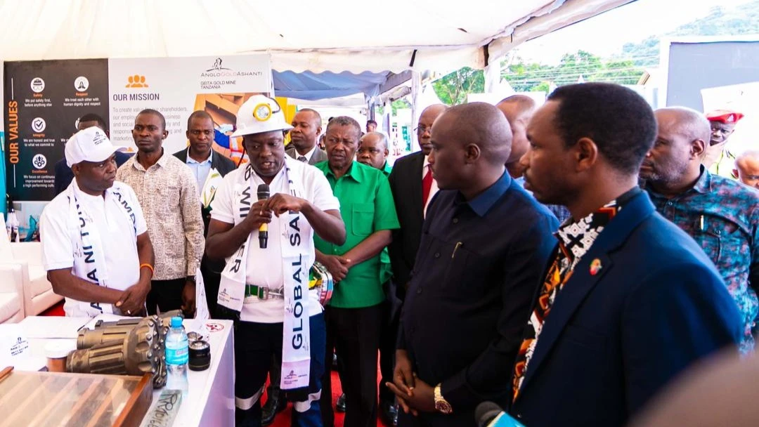 GGML's Safety Manager, Isack Senya (left), explains to the Deputy Prime Minister and Minister of Energy, Doto Biteko, how the company uses modern technology in its mining operations to focus on health and safety in the workplace. 