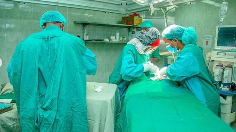 Muhimbi Specialists attending a patient