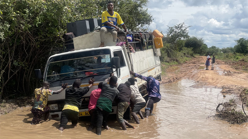INDEED, UNITY IS STRENGTH: Residents of Ngaya ward in Msalala town council, Kahama District, pictured yesterday pushing to safe ground a vehicle trapped in muddy floodwaters on the Ngaya-Busangi road.