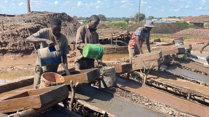 Artisanal gold miners go about their business of filtering whatever they had managed to come up with at their Mwakitolyo site in the Shinyanga municipality zone.