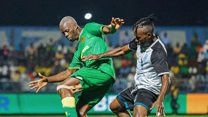 
Yanga's midfielder Stephane Aziz Ki (L) outfoxes Tabora United's center-back Heritier Lulihoshi when the teams locked horns in CRDB Bank Federation Cup's last-eight clash at Azam Complex Stadium in Dar es Salaam two days ago, ending in 3-0 Yanga victory.