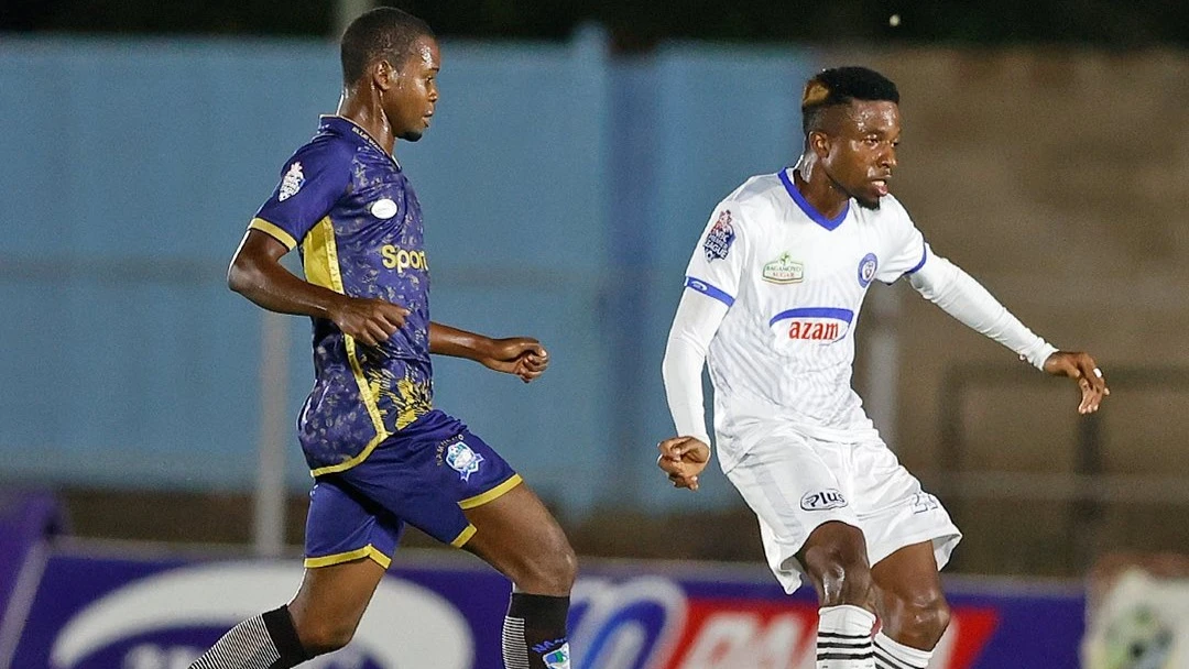 
Azam FC's midfielder Yahya Zayd (R) shoots past Namungo FC's midfielder Ayoub Semtawa when the teams met in this season's NBC Premier League match in Ruangwa, Lindi recently.