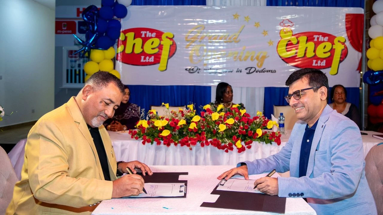 Exim Bank's Head of Merchant Acquiring & Payment Acceptance, Paritosh Babla (right), and Chef's Pride Restaurant Managing Director, Salim Mahsen Al Amry, signing their partnership agreement at the official launch of Chef's Pride Dodoma branch. 