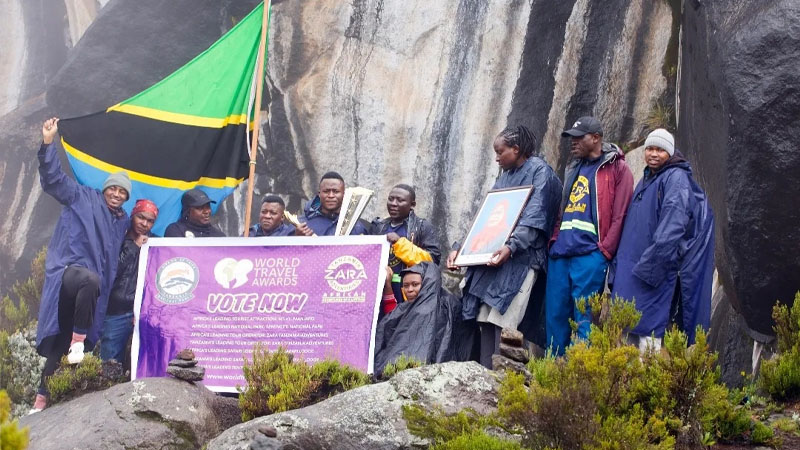 Members of a team on a special six-day climb of Mount Kilimanjaro pictured at the mountain’s Zebra Rocks point at the weekend. 