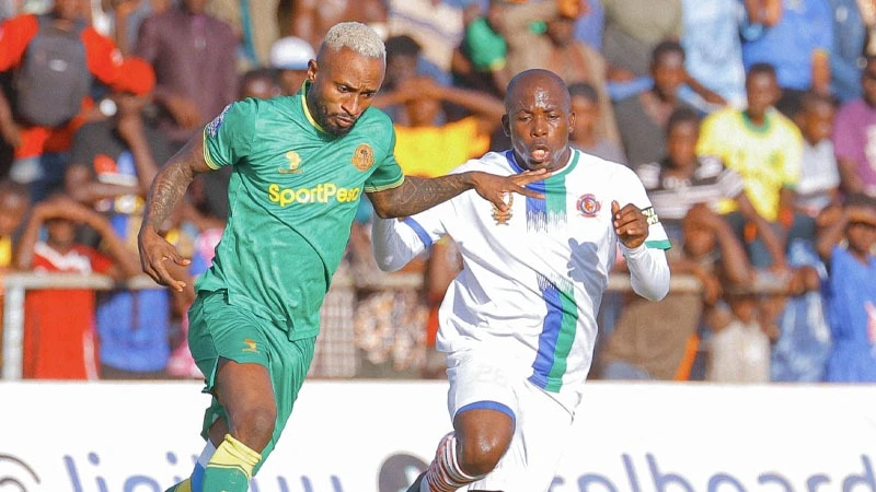 Yanga's midfielder Pacome Zouzoua (L) races past Mashujaa FC's defender when the teams met in this season's NBC Premier League clash in Kigoma last weekend which culminated in a 1-0 victory for Yanga.