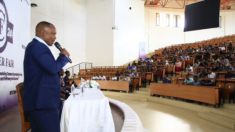 Barrick Tanzania supervisor (learning and development) Elly Shimbi pictured at the University of Dodoma on Saturday addressing students attending a capacity building workshop meant to help them confidently withstand competition 