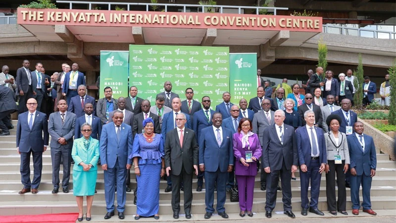 Prime Cabinet Secretary of Kenya Musalia Mudavadi (5th L front row, stands in a group photo of various heads of states, ministers, government officials, scientists, representatives of civil society.
