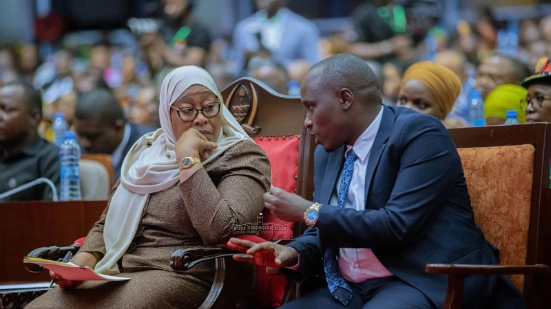 President Samia Suluhu Hassan listens to Deputy Prime Minister who is also Energy Minister Doto Biteko shortly before launching National Strategy for the Use of Clean Energy for Cooking in Dar es Salaam yesterday