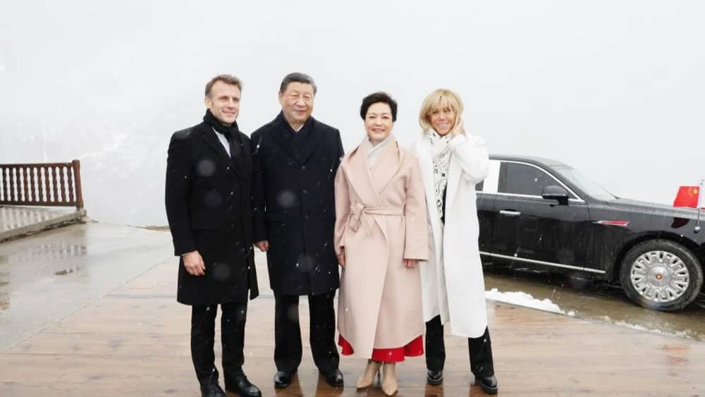 Chinese President Xi Jinping and his wife Peng Liyuan pose for a group photo with French President Emmanuel Macron and his wife Brigitte Macron at the Col du Tourmalet in Hautes-Pyrenees Department of France.