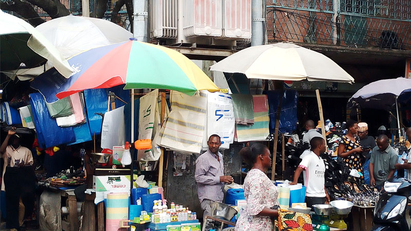 Small traders at high risk as they conduct their activities just next to a high-voltage transformer at the Tandamti Street/Nyamwezi Street intersection in Dar es Salaam’s sprawling Kariakoo market zone yesterday. 