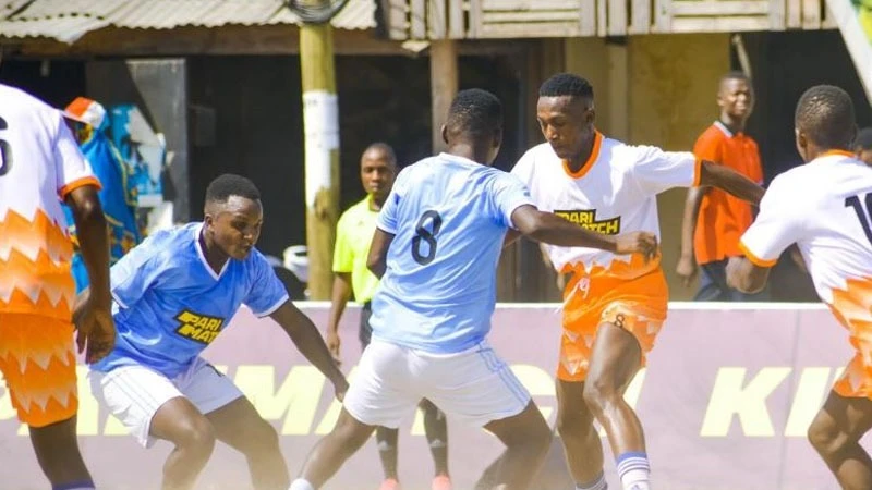  

Players of Faru Dume and Karume United competing in the opening match of the Parimatch Kitaa Cup 2024 at Zakhiem Stadium, Mbagala in Dar es Salaam over the weekend.