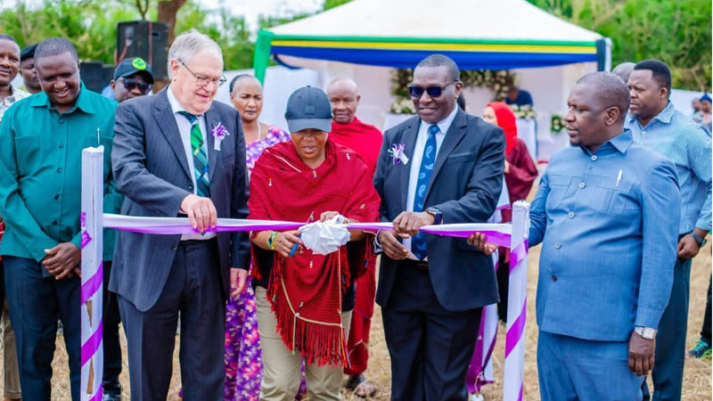 Manyara regional commissioner Queen Sendiga (C) leads officials ECLAT Development Foundation and Upendo, both agencies based in Germany, in cutting the ribbon to launch the construction of a training, skills and education centre for girls 