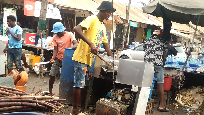 Operators of an open-air sugarcane juice ‘factory’ in business deep inside Dar es Salaam’s bustling Tegeta Nyuki Bus Stand, as found yesterday.