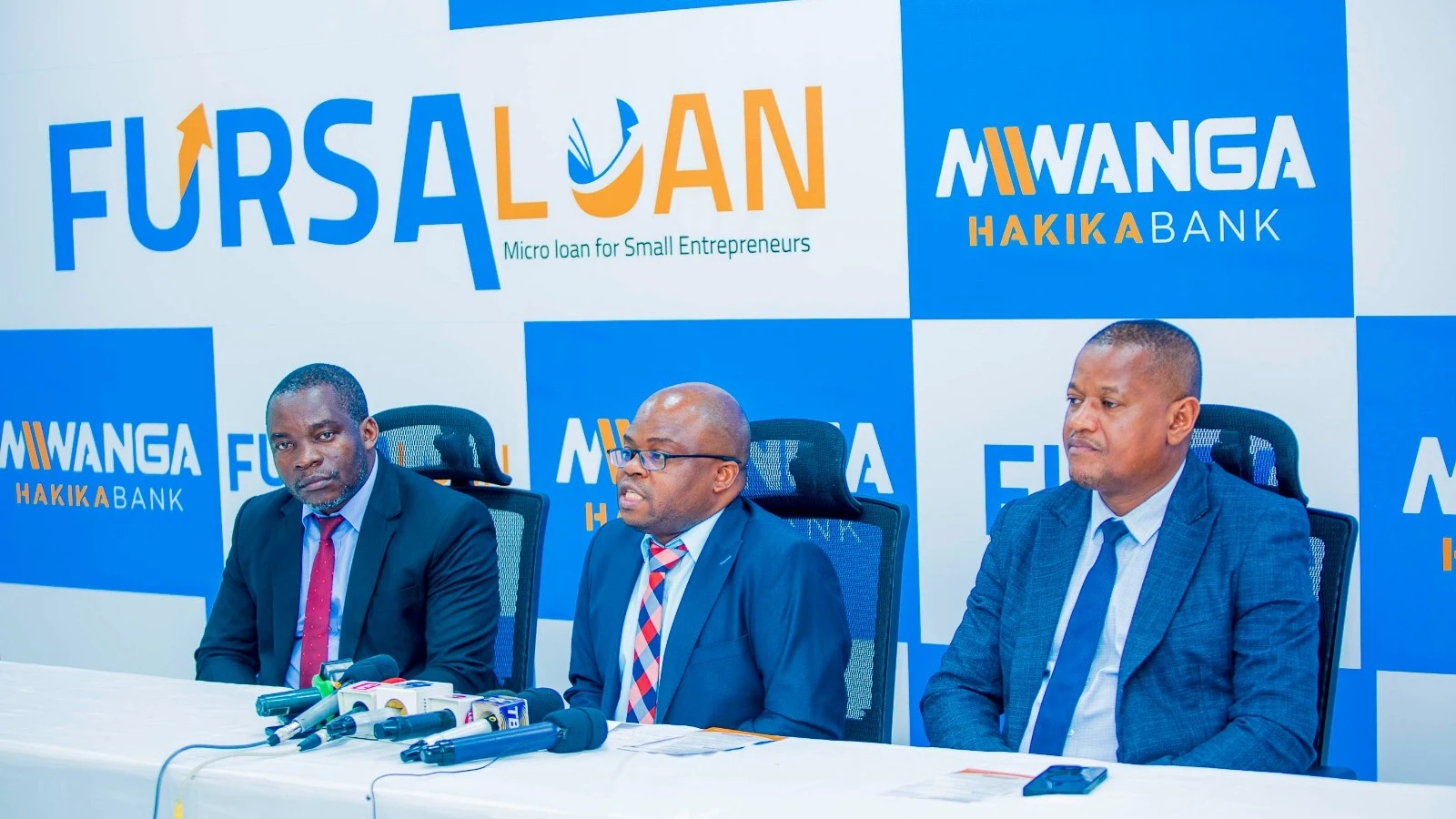 Mwanga Hakika Bank’s Head of Retail Banking Mwinyimkuu Ngalima (C) speaks to the journalists during the launch of new credit programme to support small businesses.