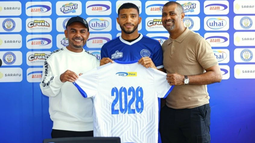 Colombian midfielder Ever Meza (C) after signing a four-year deal with Azam FC from Leones of Colombia. Looking on are the leaders of Azam FC